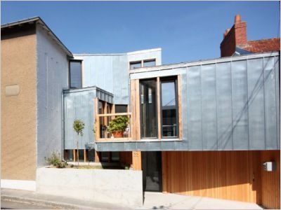 Extension et jeux de niveaux pour une maison de ville