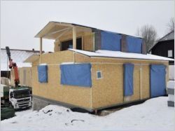 Une maison en bois massif tourillonné (diaporama)