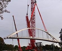 SMB réalise le levage d'une passerelle piétonne de 86 mètres de portée sans appui intermédiaire à Port-Marly (78)