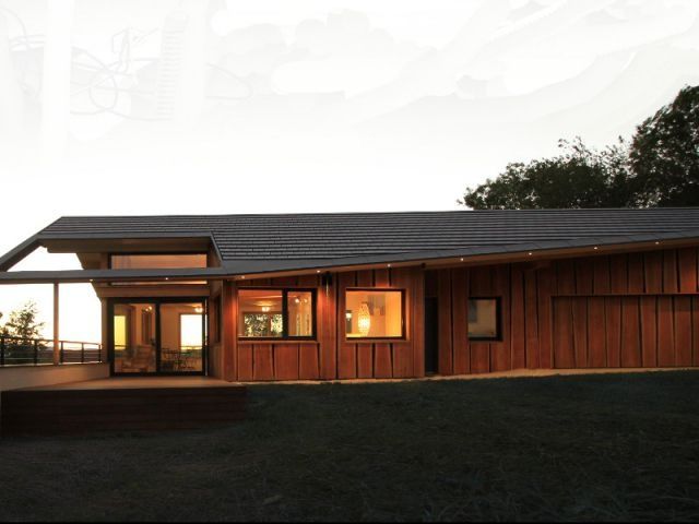 Manteau de bois et robe de verre pour une maison de montagne contemporaine